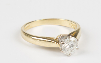 An 18ct gold and diamond single stone ring, mounted with a circular cut diamond, detailed '.75&