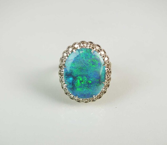 An 18ct gold black opal and diamond cluster ring