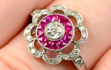 An 18ct gold diamond and French-cut ruby floral cluster ring.