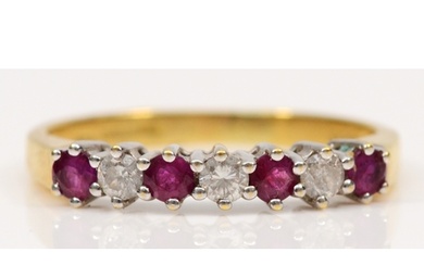 An 18ct gold ruby and brilliant cut diamond dress ring, M, 3...