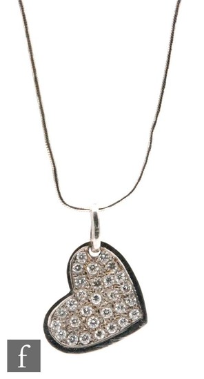 An 18ct white gold diamond set heart shaped pendant pave set...