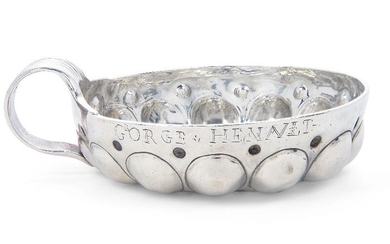 An 18th century French silver wine taster, indistinct maker's mark, possibly Etienne Tremblay, stamped with G crowned, of traditional form, the rim scratch engraved 'P...Hereault', 7.6cm dia., approx. weight 2.5oz Provenance: Works of Art from the...