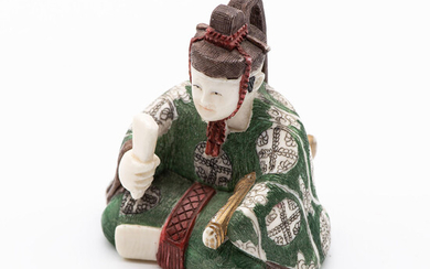 An Antique Carved Ivory Polychrome Netsuke of a Nobleman