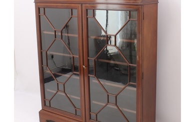 An Edwardian inlaid mahogany display cabinet or glazed bookc...