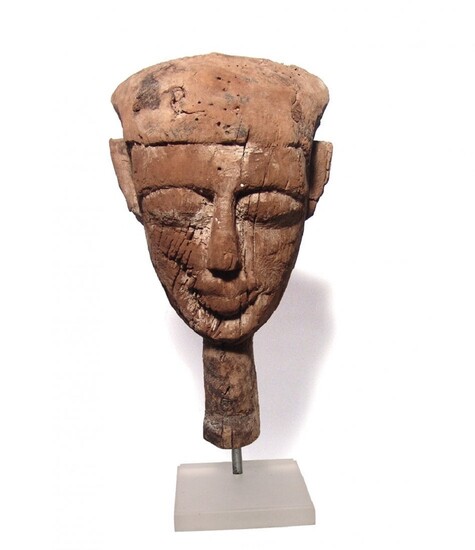 An Egyptian wood mummy mask, Late Period
