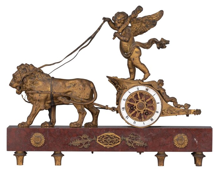 An Empire style mantle clock, with on top Cupid's chariot, H 34 - W 44 cm