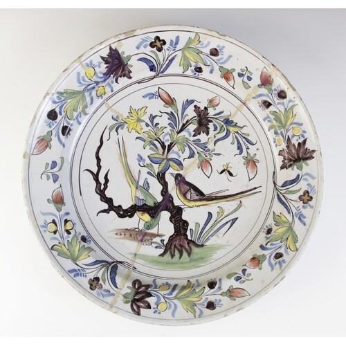 An English Delft charger, 18th century, decorated in the 'Fa...