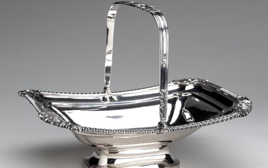 An English silver cake basket with swing handle