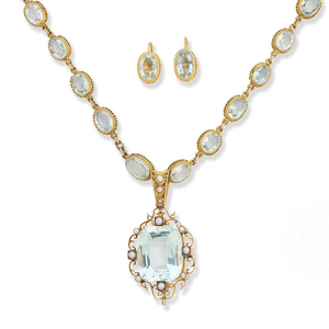 An aquamarine necklace and pair of earrings and an aquamarine and seed-pearl pendant