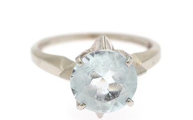 An aquamarine ring set with a circular-cut aquamarine, mounted in 14k white gold. Size app. 51.