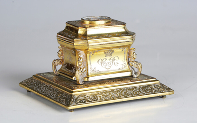 An early 19th century gilt metal inkwell of sarcophagus form, engraved with floral bands and initial