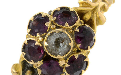 An early 20th century 15ct gold garnet and colourless paste cluster ring.