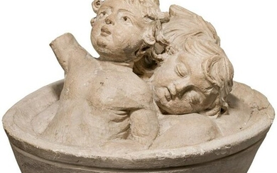 An early French sculpture of three children in a barrel