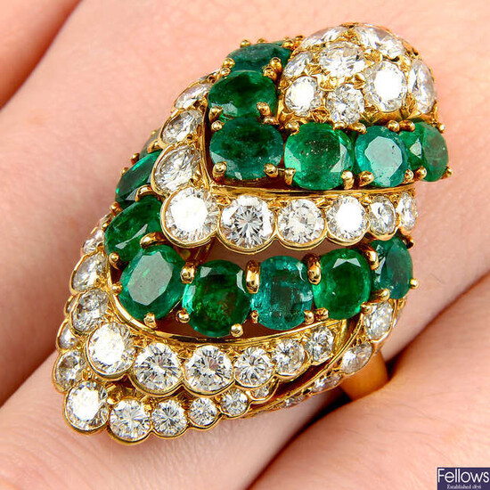 An emerald and brilliant-cut diamond cocktail ring designed as a stylised bird.