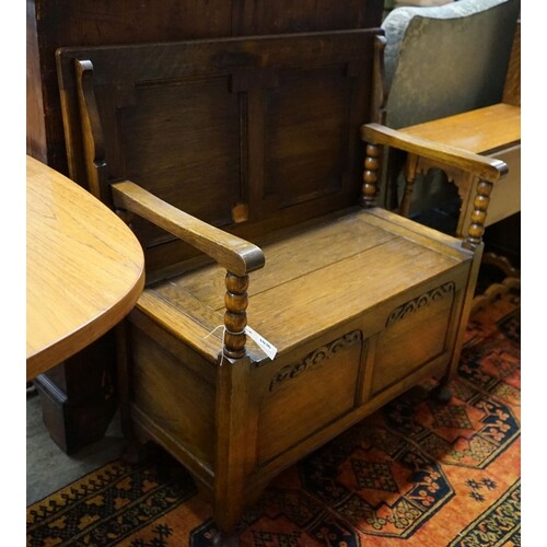 An oak monk's bench with folding top and locker seat, length...