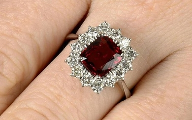 An orangey Red spinel and diamond cluster ring.With