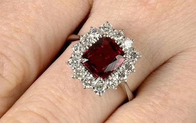 An orangey Red spinel and diamond cluster ring.