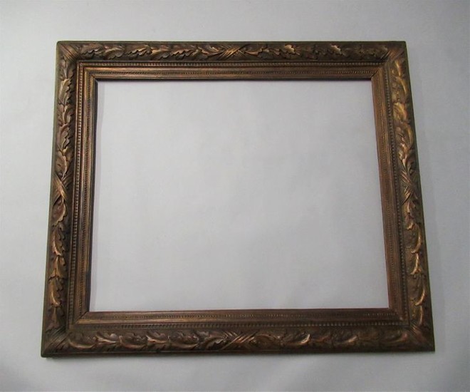Carved wood frame, gilded with copper and patinated...