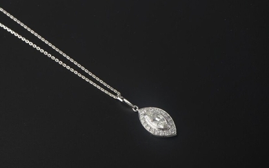 Necklace in 18k white gold, holding a platinum pendant centered on a 1.1 ct shuttle diamond in a setting of eighteen small brilliant diamonds.