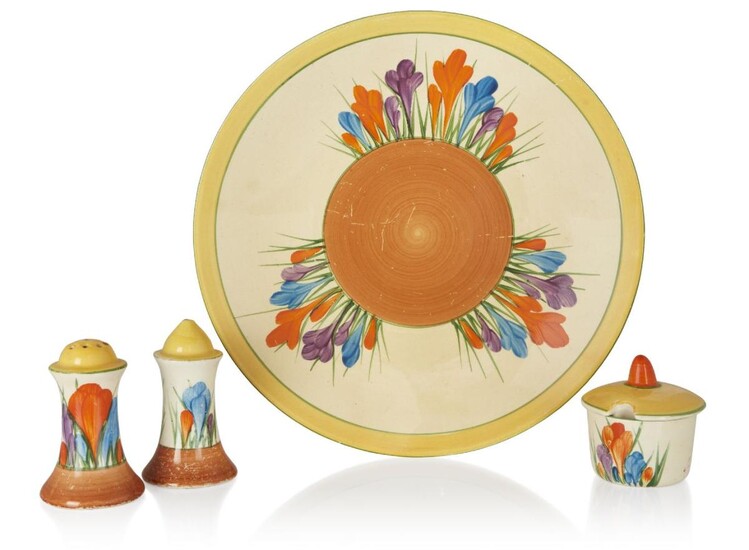 Clarice Cliff (1899-1972), Crocus pattern plate and cruet set, 1928-1936, Glazed earthenware, Plate: printed marks and impressed numbers, Salt and pepper: printed 'MADE IN ENGLAND', Mustard: printed marks for Bizarre and Crocus, all to underside...