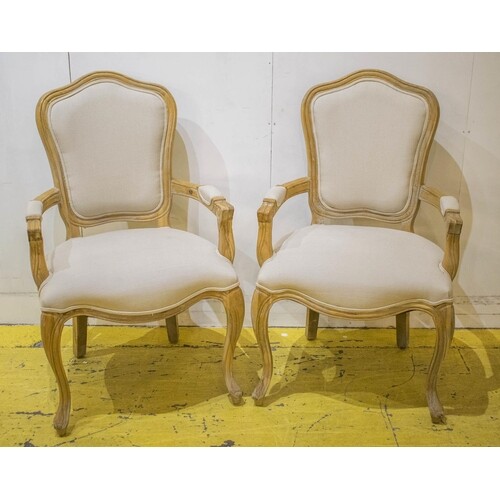 FAUTEUILS, a pair, Louis XV style oak, in taupe upholstery, ...