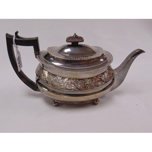 George silver teapot of oval form, with floral chased decora...