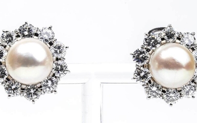 Gold, diamonds and pearls earrings 18k white gold, floreal motif with 10 mm pearls surrounded...