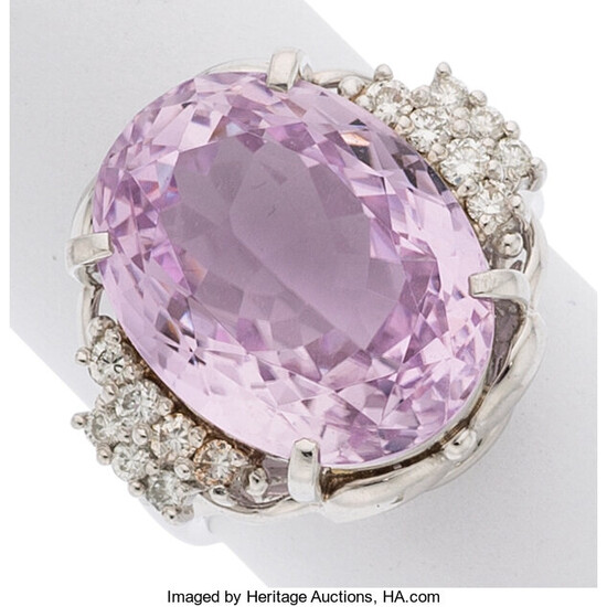 Kunzite, Diamond, Platinum Ring The ring features an oval-shaped...