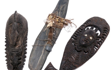 Large stone plate mounted with cloth, kaori shells and small stone axe, wooden mask and wooden meat hook. New Guinea style. H. 52–73 cm. (3)