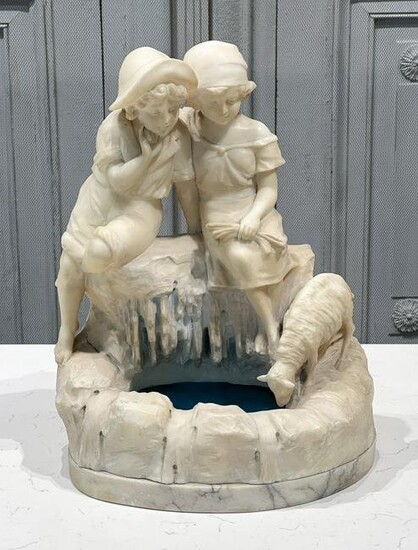 Marble Sculpture Of Couple At A Fountain