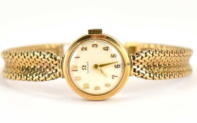 OMEGA; a ladies' 9ct gold wristwatch, white dial set with...