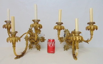 Pair of gilt bronze wall sconces, triple arms, candle sleeves chipped, sconces aren 15" tall, 13.5"