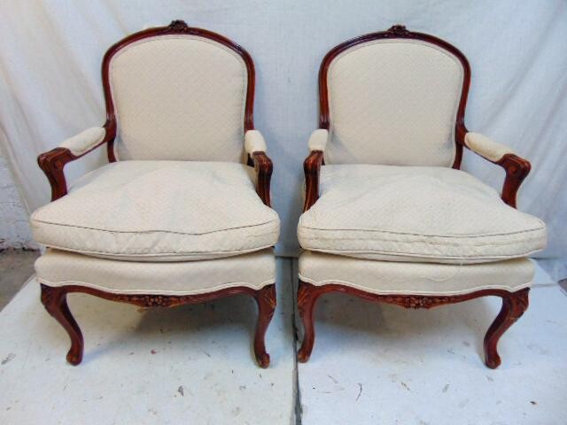 Pair upholstered bergere armchairs, carved wood frames