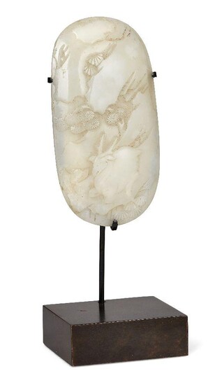 Property of a Gentleman (lots 36-85) A Chinese white jade oval plaque, 18th century, carved with a recumbent deer amidst rocks and pine trees, 11.5x6cm