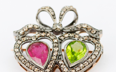 SILVER FRONTED PERIDOT, RUBY AND DIAMOND BROOCH.