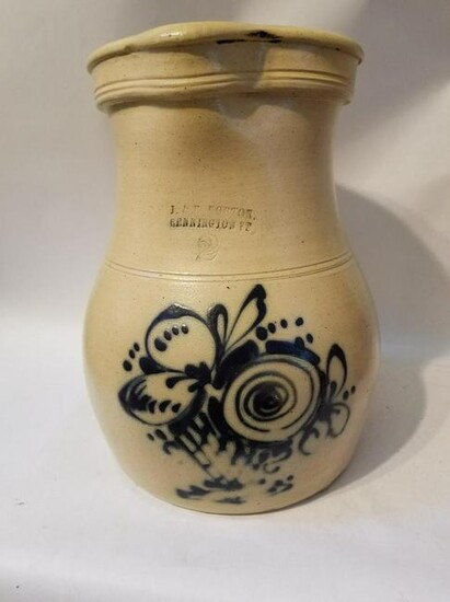 Stoneware pitcher with flower basket decoration