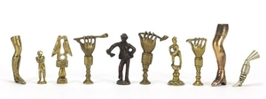 Ten antique pipe tampers including figural, leg and Napoleon...