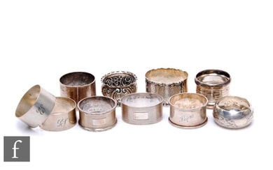 Ten assorted hallmarked silver napkin rings to include oval ...