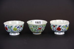Three Chinese hand painted porcelain tea bowls, Dia. 8cm D. 4.5cm.