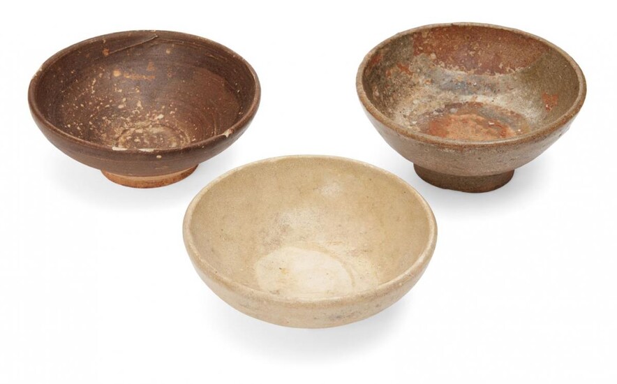 Three Chinese stoneware bowls, Yuan/Ming dynasty, all of shallow form,...