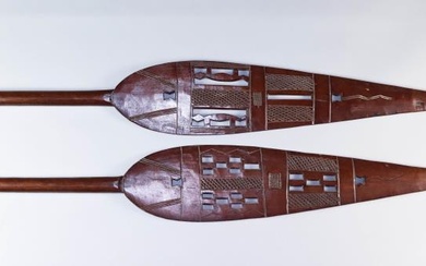 Two African Hardwood Paddles, 20th Century, the blades with...