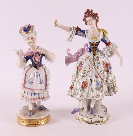 (-), Two polychrome porcelain figures, including a woman...