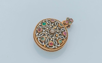 18 karat (750 thousandths) yellow gold pendant opening, decorated with a motif enhanced with four rubies and four emeralds centred on a rose-cut diamond, in a four-lobed interlacing pattern enhanced with white enamel, on the back a similar motif...