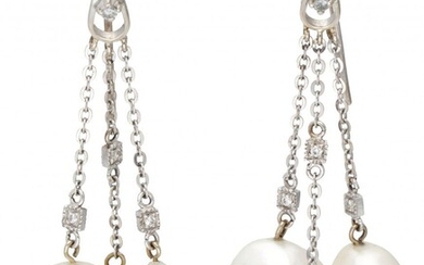 18K. White gold earrings each with three strands, approx. 0.10 ct. diamond and freshwater pearls....