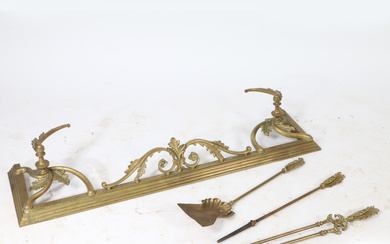 3376566. A 19TH CENTURY ROCOCO GILT BRASS FENDER AND MATCHING COMPANION SET.