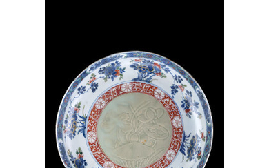 A blue and white and iron red enamelled dish, the centre with a celadon glaze, decorated with floral motifs (defects)...