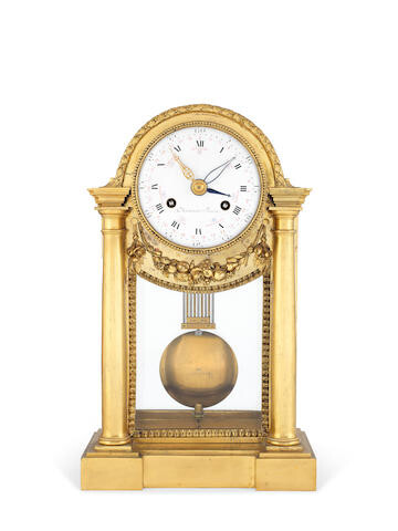 A late 18th century French ormolu portico clock with concentric calendar