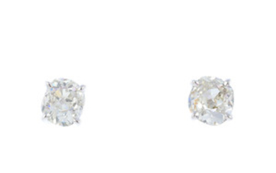 A pair of 18ct gold old-cut diamond stud earrings. View more details