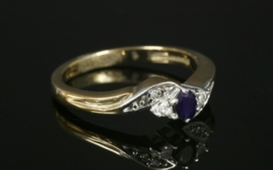 A 9ct gold sapphire and diamond three stone crossover ring