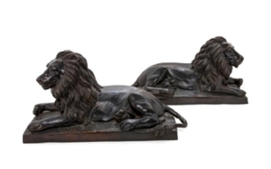 A Pair of Bronze Models of Recumbent Lions